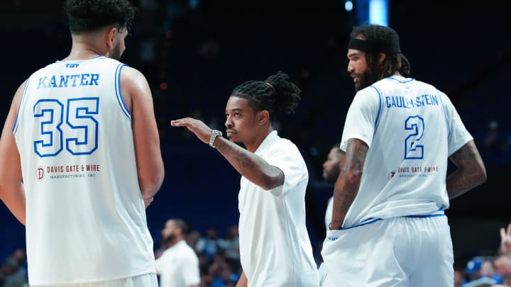 Kentucky La Familia head coach Tyler Ulis, center, encourages Kerem Kanter (35) against The Nawf during the TBT tournament at Rupp Arena in Lexington, Ky. on July 21, 2024.