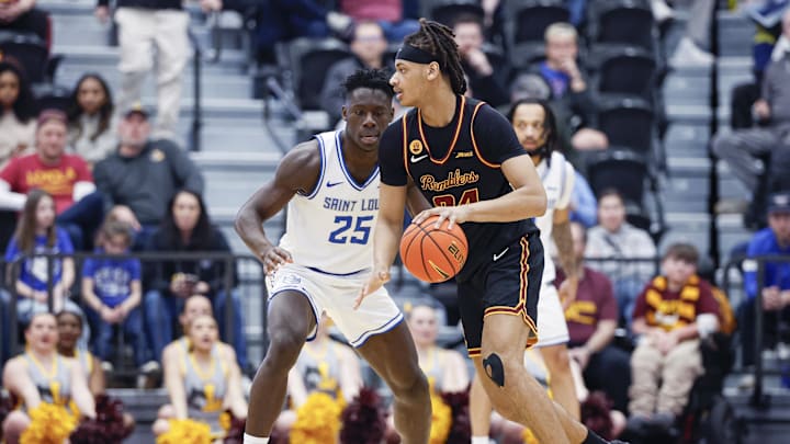 Feb 13, 2026; Chicago, Illinois, USA; Saint Louis Billikens forward Paul Otieno (25) defends against Loyola Chicago Ramblers center Miles Rubin (24) during the second half at Joseph J. Gentile Arena. Mandatory Credit: Kamil Krzaczynski-Imagn Images