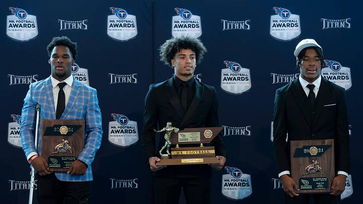 Division I - Class 6A 2024 Tennessee Titans Mr. Football Donovan Starr, Ravenwood High School, center, is flanked by finalists Samuel Iroh, Collierville High School, left, and Craig Tutt, Oakland High School, during the Titans Mr. Football Awards at Nissan Stadium in Nashville, Tenn., Tuesday, Dec. 10, 2024.