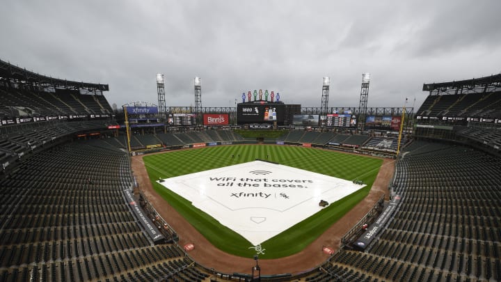 May 9, 2024; Chicago, Illinois, USA; A tarp covers the infield before a baseball game between the