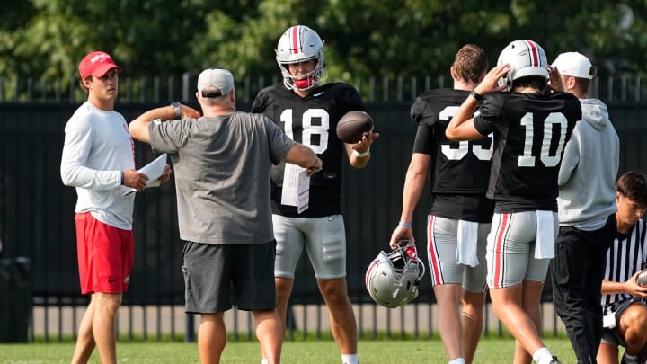 Aug 8, 2024; Columbus, Ohio, USA; Ohio State Buckeyes offensive coordinator Chip Kelly works with quarterback Will Howard (18) during football practice at the Woody Hayes Athletic Complex.