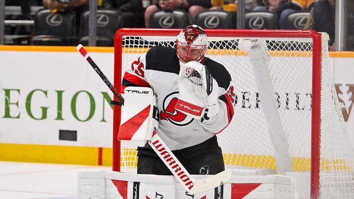 Mar 26, 2026; Nashville, Tennessee, USA;  New Jersey Devils goaltender Jacob Markstrom (25) makes a glove save against the Nashville Predators during the first period at Bridgestone Arena. Mandatory Credit: Steve Roberts-Imagn Images