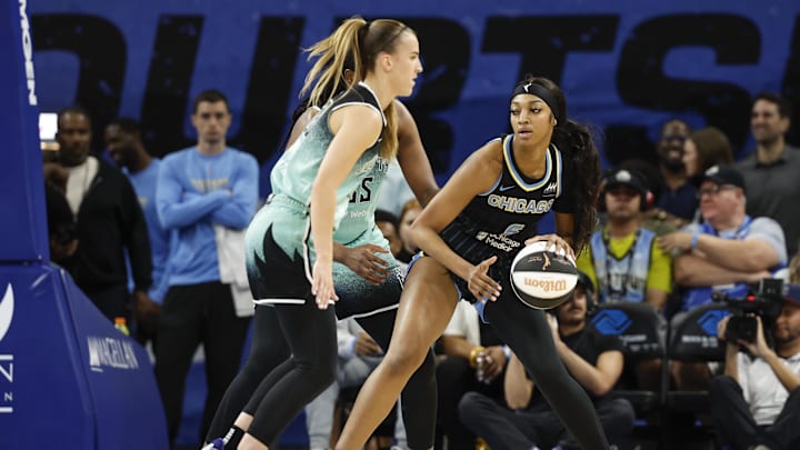 Jun 4, 2024; Chicago, Illinois, USA; Chicago Sky forward Angel Reese (5) controls the ball against the New York Liberty during the first half of a WNBA game at Wintrust Arena. Mandatory Credit: Kamil Krzaczynski-Imagn Images