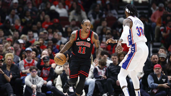 Dec 30, 2023; Chicago, Illinois, USA; Chicago Bulls forward DeMar DeRozan (11) brings the ball up court against the Philadelphia 76ers during the first half at United Center. Mandatory Credit: Kamil Krzaczynski-Imagn Images