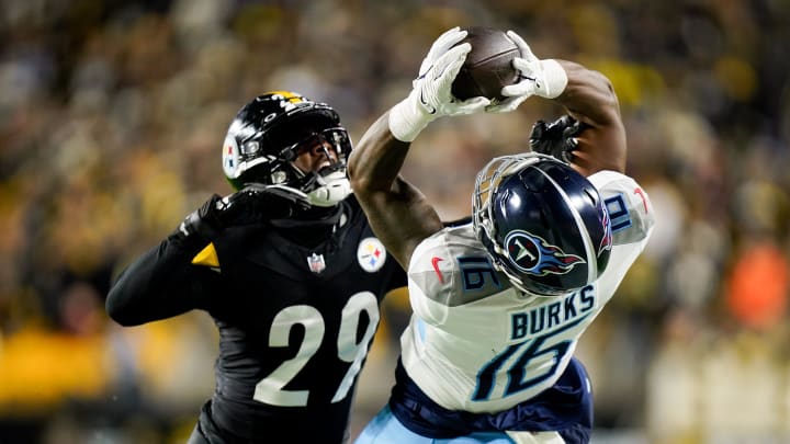 Tennessee Titans wide receiver Treylon Burks (16) leaps for the ball under Pittsburgh Steelers cornerback Levi Wallace (29) before falling hard on the field resulting in an injury during the fourth quarter in Pittsburgh, Pa., Thursday, Nov. 2, 2023.
