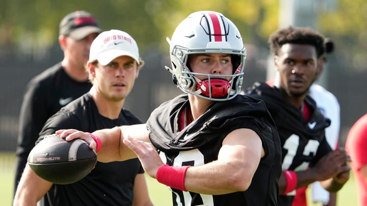 Ohio State Buckeyes quarterback Will Howard (18) throws during football camp 