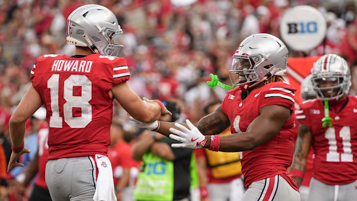 Aug 31, 2024; Columbus, OH, USA; Ohio State Buckeyes running back Quinshon Judkins (1) celebrates scoring a touchdown with quarterback Will Howard (18) during the NCAA football game against the Akron Zips at Ohio Stadium. Ohio State won 52-6.