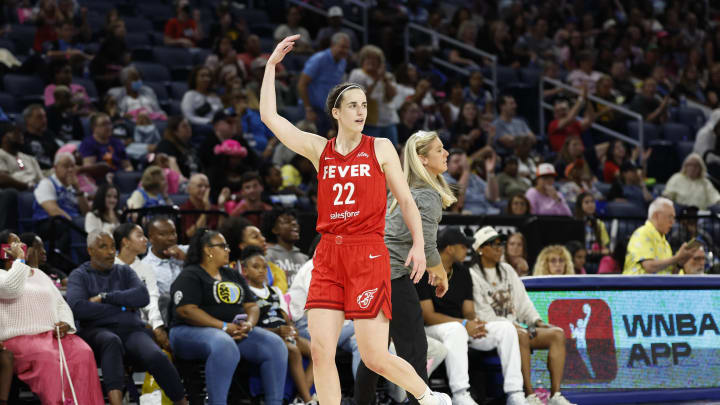 Aug 30, 2024; Chicago, Illinois, USA; Indiana Fever guard Caitlin Clark (22) reacts as she walks off the floor during the second half of a basketball game against the Chicago Sky at Wintrust Arena. 