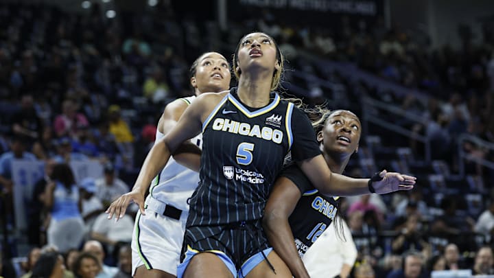 Jul 12, 2025; Chicago, Illinois, USA; Chicago Sky forward Angel Reese (5) and forward Michaela Onyenwere (12) defend against Minnesota Lynx forward Napheesa Collier (24) during the first half of a WNBA game at Wintrust Arena. Mandatory Credit: Kamil Krzaczynski-Imagn Images