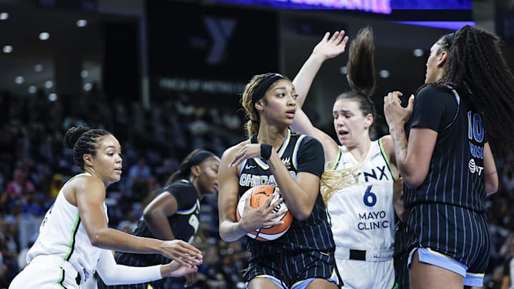 Jul 12, 2025; Chicago, Illinois, USA; Chicago Sky forward Angel Reese (5) grabs a rebound against the Minnesota Lynx during the first half of a WNBA game at Wintrust Arena. Mandatory Credit: Kamil Krzaczynski-Imagn Images