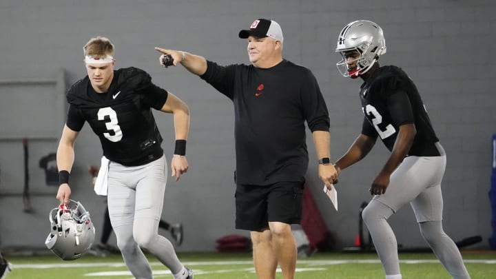 Mar 5, 2024; Columbus, OH, USA; Ohio State Buckeyes offensive coordinator Chip Kelly works with quarterbacks Lincoln Kienholz (3) and Air Noland (12) during the first spring practice at the Woody Hayes Athletic Center.