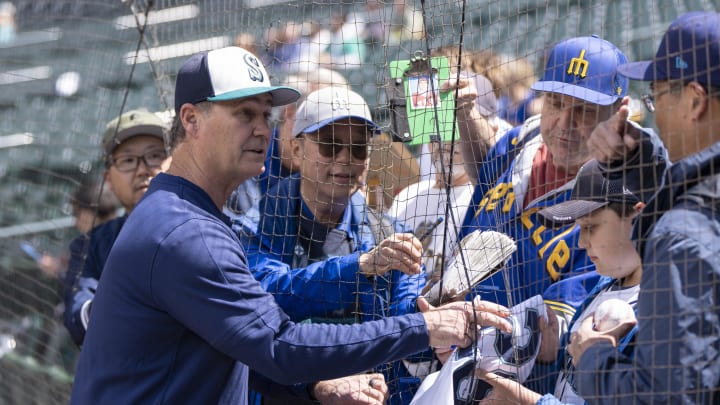 Seattle Mariners manager Scott Servais signs autographs for fans before a game against the Texas Rangers at T-Mobile Park on June 15.