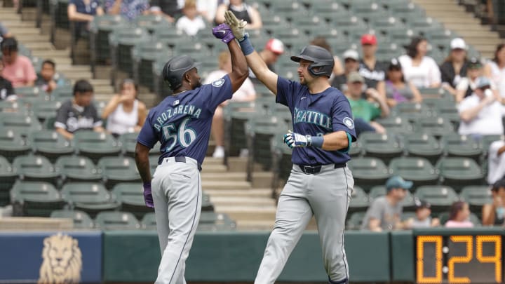 Seattle Mariners catcher Cal Raleigh (right) celebrates with outfielder Randy Arozarena (left) after hitting a two-run home run against the Chicago White Sox.