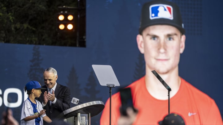 MLB commissioner Rob Manfred, right, and Tiago Viernes announce Colt Emerson as the Seattle Mariners pick during the first round of the MLB Draft at Lumen Field on July 9, 2023.