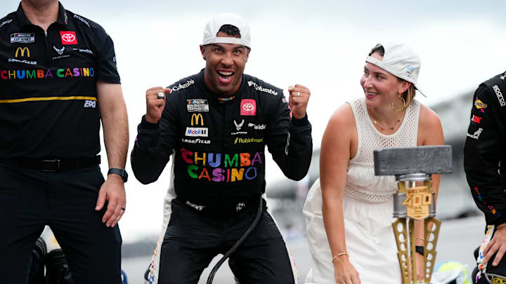 NASCAR Cup Series driver Bubba Wallace (23) celebrates on the yard of bricks Sunday, July 27, 2025, during the Brickyard 400 at Indianapolis Motor Speedway.