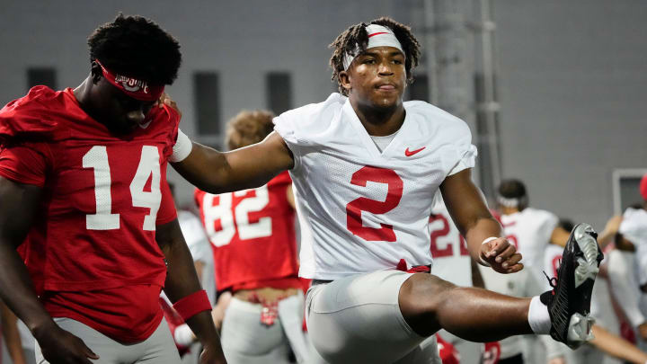 Mar 5, 2024; Columbus, OH, USA; Ohio State Buckeyes safety Caleb Downs (2) stretches with wide receiver Kojo Antwi (14) during the first spring practice at the Woody Hayes Athletic Center.