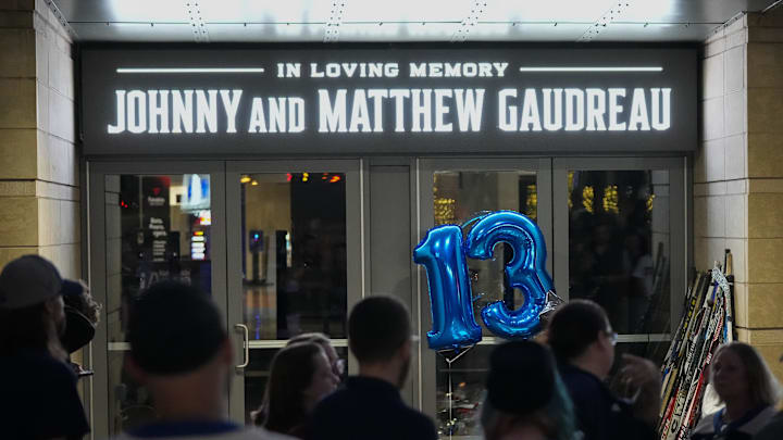 Sep 4, 2024; Columbus, OH, USA; Mourners gather for a candlelight vigil to remember Columbus Blue Jackets forward Johnny Gaudreau at Nationwide Arena. Gaudreau, along with his brother, Matthew, died in a bicycle crash on Aug. 29.