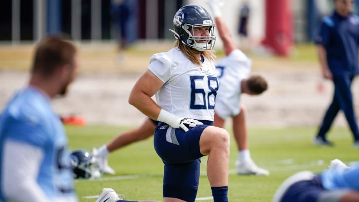 Tennessee Titans guard Zack Johnson (68) stretches during an OTA practice at Ascension Saint Thomas Sports Park in Nashville, Tenn., Wednesday, June 14, 2023.