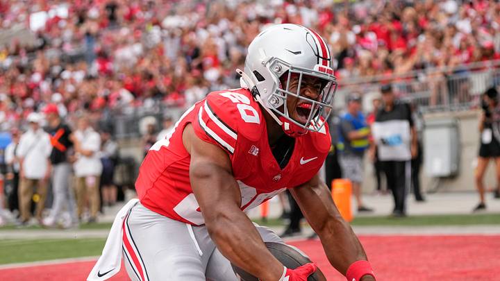 Aug 31, 2024; Columbus, OH, USA; Ohio State Buckeyes running back James Peoples (20) celebrates a touchdown during the second half of the NCAA football game against the Akron Zips at Ohio Stadium. Ohio State won 52-6.