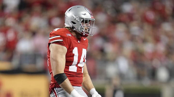 Ohio State Buckeyes defensive lineman Beau Atkinson (14) celebrates a stop during the NCAA football game against the Minnesota Golden Gophers at Ohio Stadium in Columbus on Oct. 4, 2025.