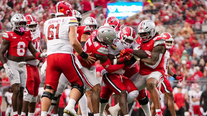 Ohio State Buckeyes linebacker Riley Pettijohn (5) and defensive end Eddrick Houston (96) stop Maryland Terrapins running back DeJuan Williams (0) during the NCAA football game at Ohio Stadium in Columbus on Oct. 10, 2026.