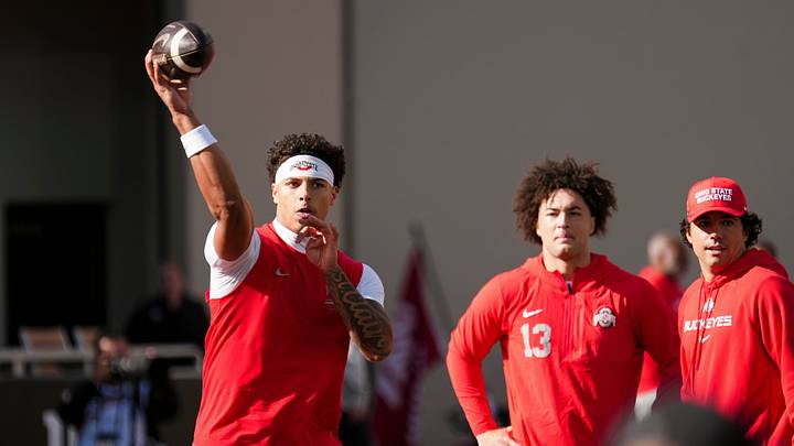Ohio State Buckeyes quarterback Tavien St. Clair (9) warms up beside quarterback Luke Fahey (13) during the NCAA football game against the Indiana Hoosiers at Memorial Stadium Stadium in Bloomington, Ind. on Oct. 17, 2026.