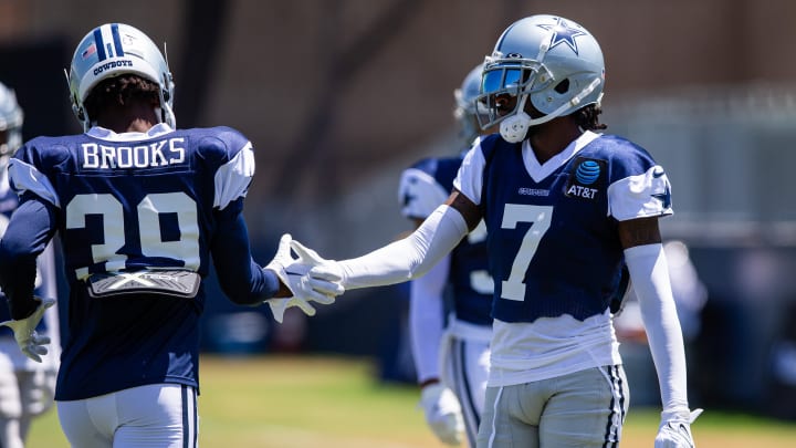 Aug 1, 2023; Oxnard, CA, USA; Dallas Cowboys cornerback Trevon Diggs (7) congratulates cornerback Myles Brooks (39) after a drill during training camp at Marriott Residence Inn-River Ridge playing fields.