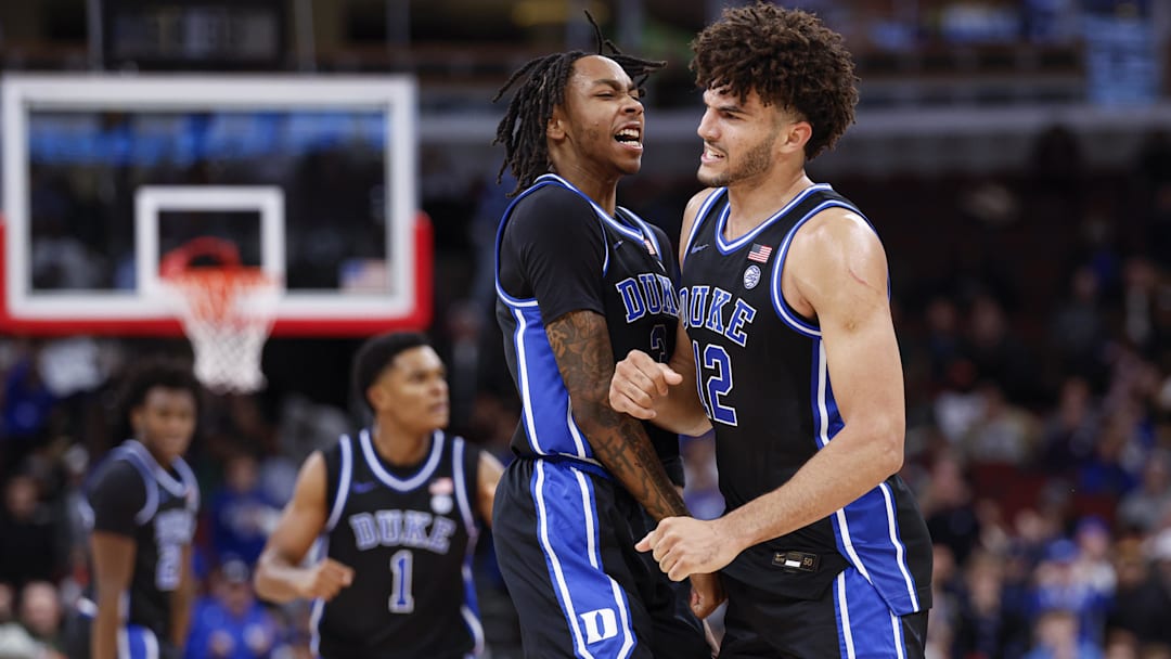 Nov 27, 2025; Chicago, Illinois, USA; Duke Blue Devils forward Cameron Boozer (12) celebrates with guard Isaiah Evans (3) during the second half at United Center. Mandatory Credit: Kamil Krzaczynski-Imagn Images