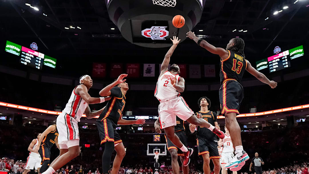 Ohio State Buckeyes guard Bruce Thornton (2) shoots around Kam Woods during the second half of the NCAA men's basketball game at the Schottenstein Center on Feb. 11, 2026. Ohio State won 89-82.