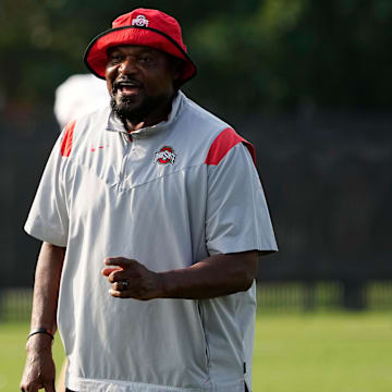 Aug 8, 2024; Columbus, Ohio, USA; Ohio State Buckeyes defensive line coach Larry Johnson talks to players during football practice at the Woody Hayes Athletic Complex.