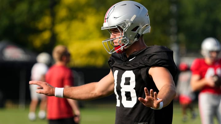 Aug 8, 2024; Columbus, Ohio, USA; Ohio State Buckeyes quarterback Will Howard (18) takes a snap during football practice at the Woody Hayes Athletic Complex.