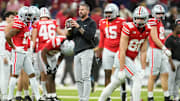 Ohio State Buckeyes offensive coordinator Brian Hartline warms up players during the Big Ten Conference championship game against the Indiana Hoosiers at Lucas Oil Stadium in Indianapolis on Dec. 6, 2025. Ohio State lost 13-10.