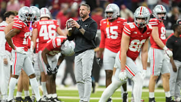 Ohio State Buckeyes offensive coordinator Brian Hartline warms up players during the Big Ten Conference championship game against the Indiana Hoosiers at Lucas Oil Stadium in Indianapolis on Dec. 6, 2025. Ohio State lost 13-10.