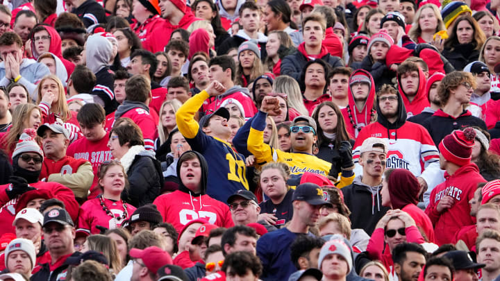 Nov 26, 2022; Columbus, Ohio, USA;  Michigan Wolverines fans celebrate a touchdown by Michigan Wolverines running back Donovan Edwards (7) during the second half of the NCAA football game at Ohio Stadium. Ohio State lost 45-23. Mandatory Credit: Adam Cairns-The Columbus Dispatch

Ncaa Football Michigan Wolverines At Ohio State Buckeyes