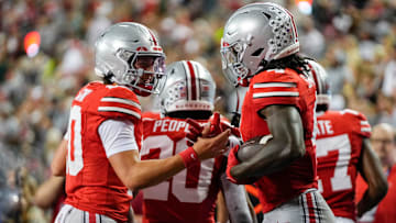 Ohio State Buckeyes quarterback Julian Sayin (10) celebrates a touchdown by wide receiver Jeremiah Smith (4) during the second half of the NCAA football game against the Ohio Bobcats at Ohio Stadium on Sept. 13, 2025. Ohio State won 37-9.