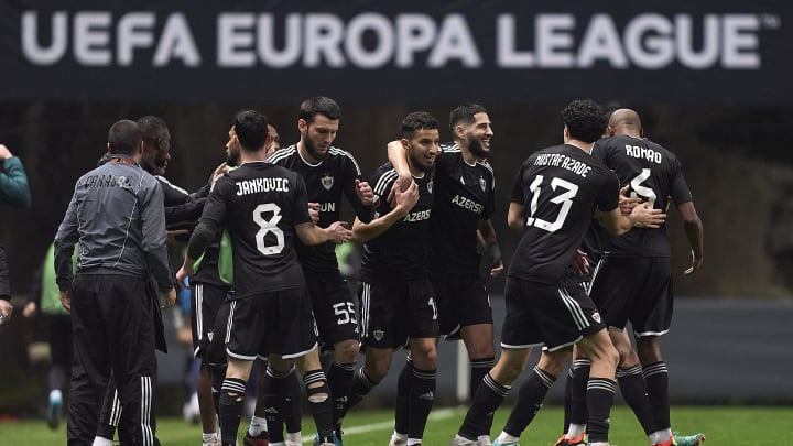Qarabag FK players celebrate during their UEFA Europa League match against Portugal's Braga. The Azerbaijani side is the first club from Azerbaijan to reach the Round of 16 in a UEFA tournament.