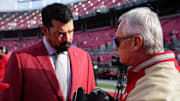 Ohio State Buckeyes head coach Ryan Day talks to former head coach and current Ohio lieutenant governor Jim Tressel prior to the NCAA football game against the Rutgers Scarlet Knights at Ohio Stadium in Columbus on Nov. 22, 2025.