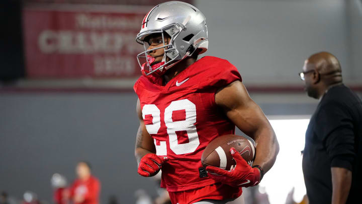 Mar 5, 2024; Columbus, OH, USA; Ohio State Buckeyes running back TC Caffey (28) runs during the first spring practice at the Woody Hayes Athletic Center.