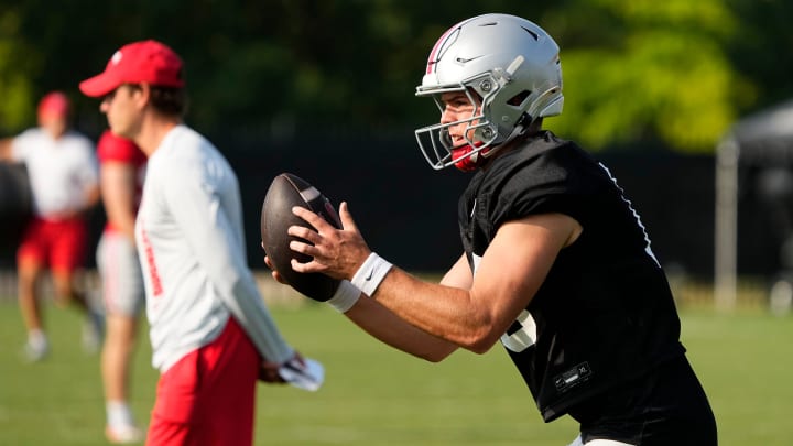 Aug 8, 2024; Columbus, Ohio, USA; Ohio State Buckeyes quarterback Will Howard (18) takes a snap during football practice at the Woody Hayes Athletic Complex.