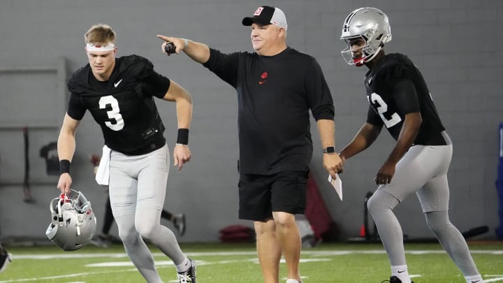 Mar 5, 2024; Columbus, OH, USA; Ohio State Buckeyes offensive coordinator Chip Kelly works with quarterbacks Lincoln Kienholz (3) and Air Noland (12) during the first spring practice at the Woody Hayes Athletic Center.