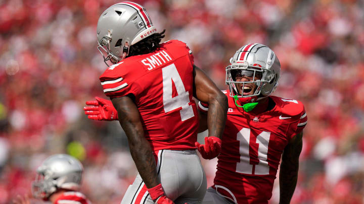 Aug 31, 2024; Columbus, OH, USA; Ohio State Buckeyes wide receiver Brandon Inniss (11) celebrates a touchdown catch by wide receiver Jeremiah Smith (4) during the first half of the NCAA football game against the Akron Zips at Ohio Stadium.