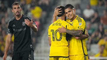 Jul 3, 2024; Columbus, OH, USA; Columbus Crew forward Cucho Hernandez (9) hugs forward Diego Rossi (10) in front of Nashville SC defender Jack Maher (5) during the second half of the MLS soccer game at Lower.com Field. The Crew won 2-0.
