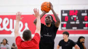 Jul 9, 2024; Columbus, OH, USA; Ohio State Buckeyes forward Aaron Bradshaw shoots over head coach Jake Diebler during a summer workout in the practice gym at the Schottenstein Center.