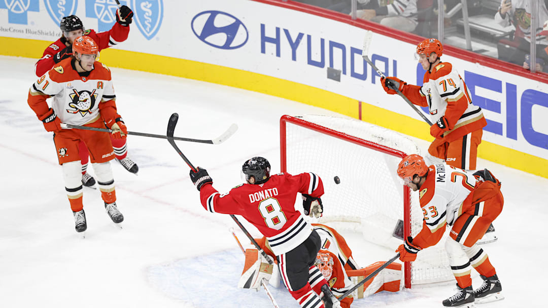 Oct 19, 2025; Chicago, Illinois, USA; Chicago Blackhawks center Ryan Donato (8) scores in overtime a game winning goal against the Anaheim Ducks at United Center. Mandatory Credit: Kamil Krzaczynski-Imagn Images