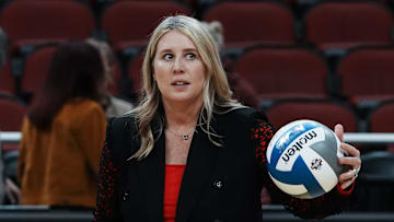 Louisville head coach Dani Busboom Kelly helps her team warm up ahead of their Final Four match against Pittsburgh at the KFC Yum! Center in Louisville, Ky. on Dec. 19, 2024.