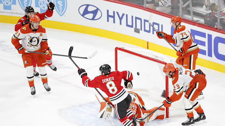 Oct 19, 2025; Chicago, Illinois, USA; Chicago Blackhawks center Ryan Donato (8) scores in overtime a game winning goal against the Anaheim Ducks at United Center. Mandatory Credit: Kamil Krzaczynski-Imagn Images