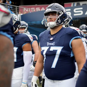 Tennessee Titans offensive tackle Peter Skoronski (77) heads out for warm ups before a game against the Carolina Panthers at Nissan Stadium in Nashville, Tenn., Sunday, Nov. 26, 2023.