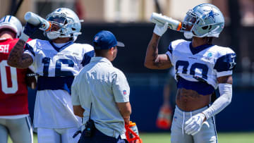 Aug 1, 2023; Oxnard, CA, USA; Dallas Cowboys wide receiver Jalen Moreno-Cropper (16) and wide receiver Tyron Johnson (80) hydrate during training camp at Marriott Residence Inn-River Ridge playing fields. Mandatory Credit: Jason Parkhurst-USA TODAY Sports