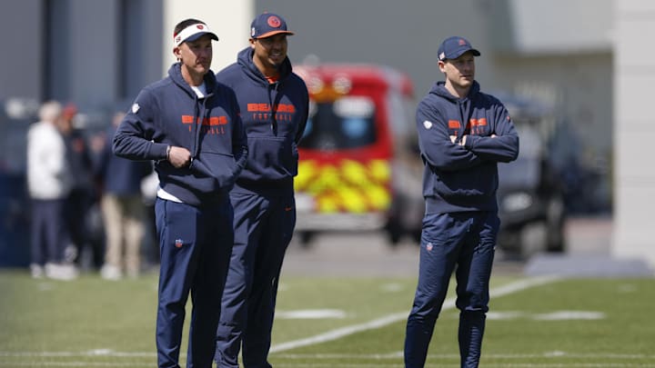 May 9, 2025; Lake Forest, IL, USA; Chicago Bears head coach Ben Johnson (R) looks on during the Rookie Minicamp at Halas Hall. Mandatory Credit: Kamil Krzaczynski-Imagn Images