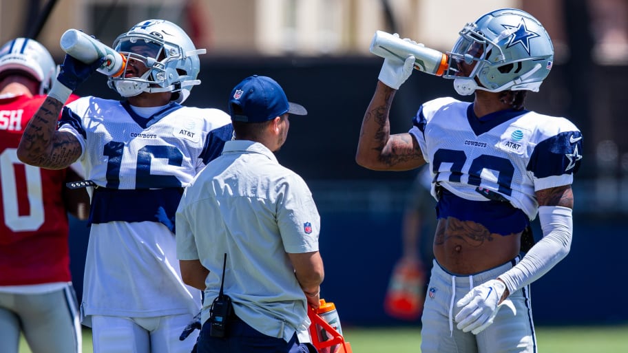 Aug 1, 2023; Oxnard, CA, USA; Dallas Cowboys wide receiver Jalen Moreno-Cropper (16) and wide receiver Tyron Johnson (80) hydrate during training camp at Marriott Residence Inn-River Ridge playing fields. Mandatory Credit: Jason Parkhurst-USA TODAY Sports | Jason Parkhurst-USA TODAY Sports